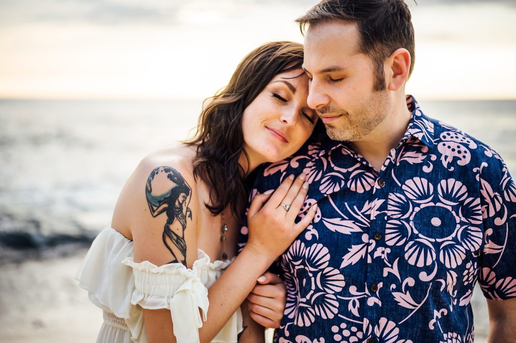 woman leaning on man's shoulders during Hawaii engagement session