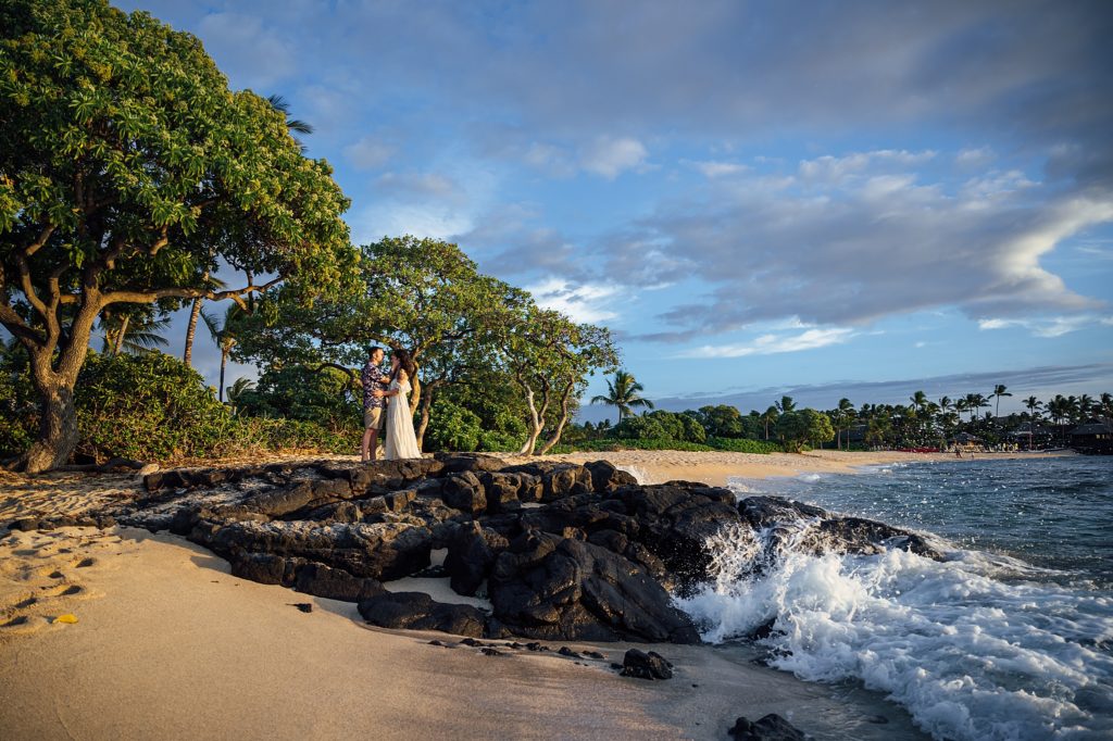 couple standing on the lava rocks by Big Island photographer