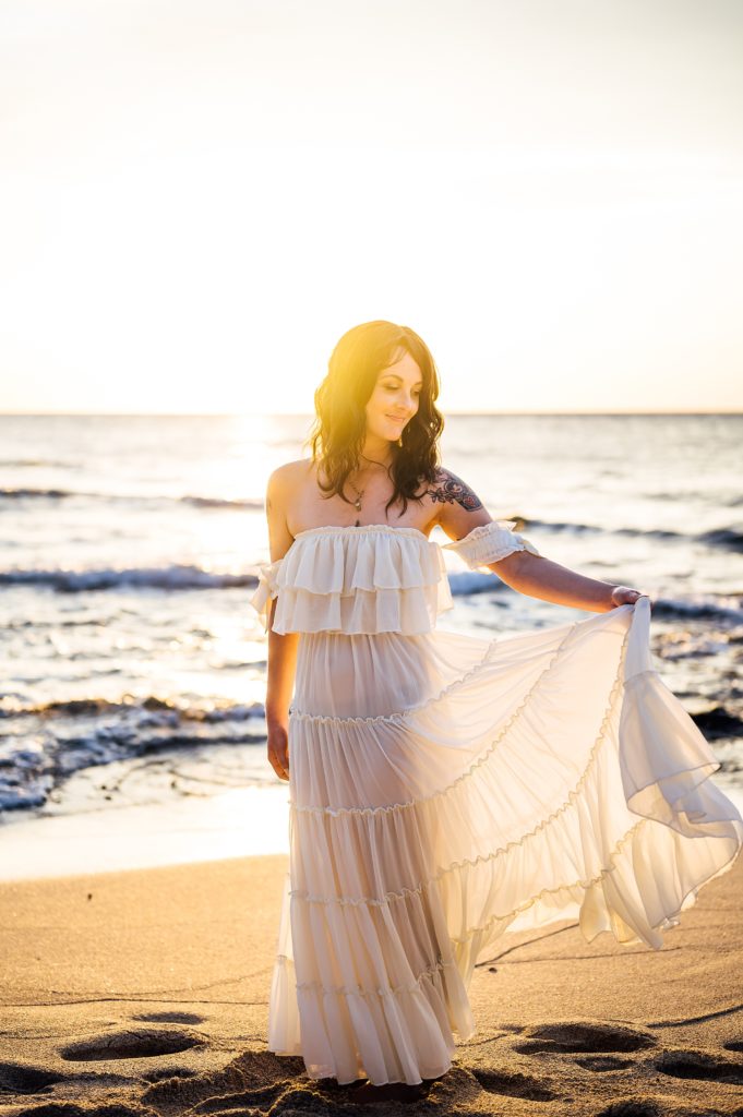stunning Hawaii sunset behind the lady during her engagement session