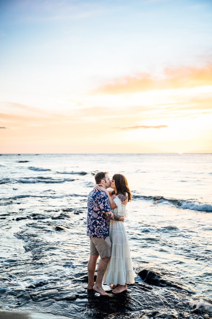 couple kissing at a beach in the Big Island