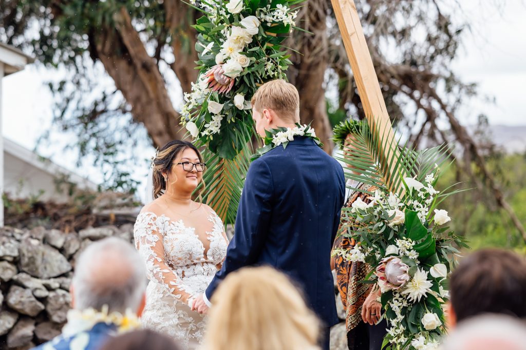 bride and groom holding hands during their Big Island wedding ceremony