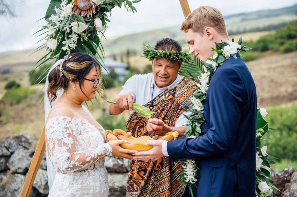 ring blessing during a Hawaii wedding at Anna Ranch