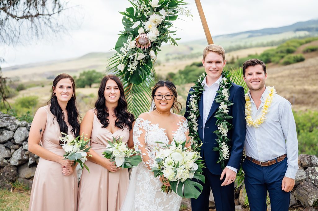 bride and groom with their wedding party during their Hawaii wedding