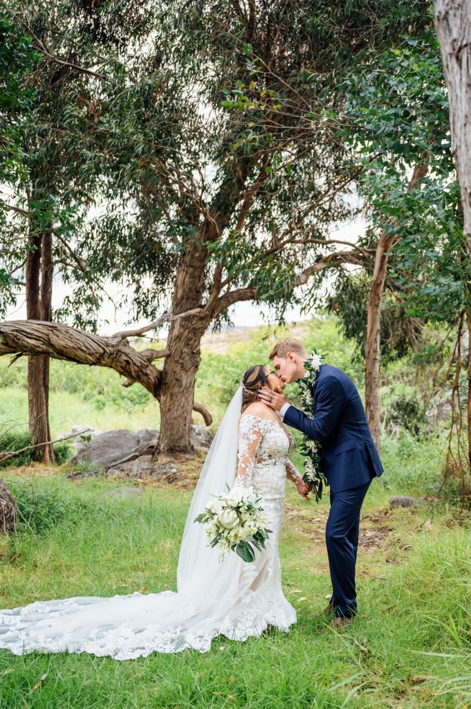bride and groom kiss during their Big Island wedding