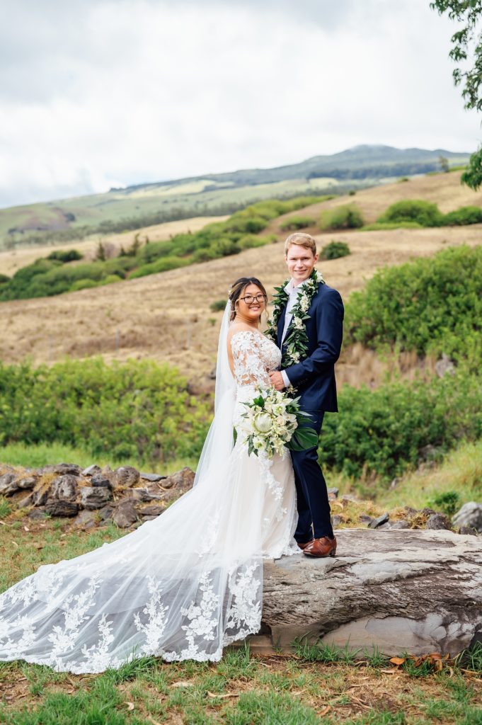 couple standing on the rocks during their Big Island wedding