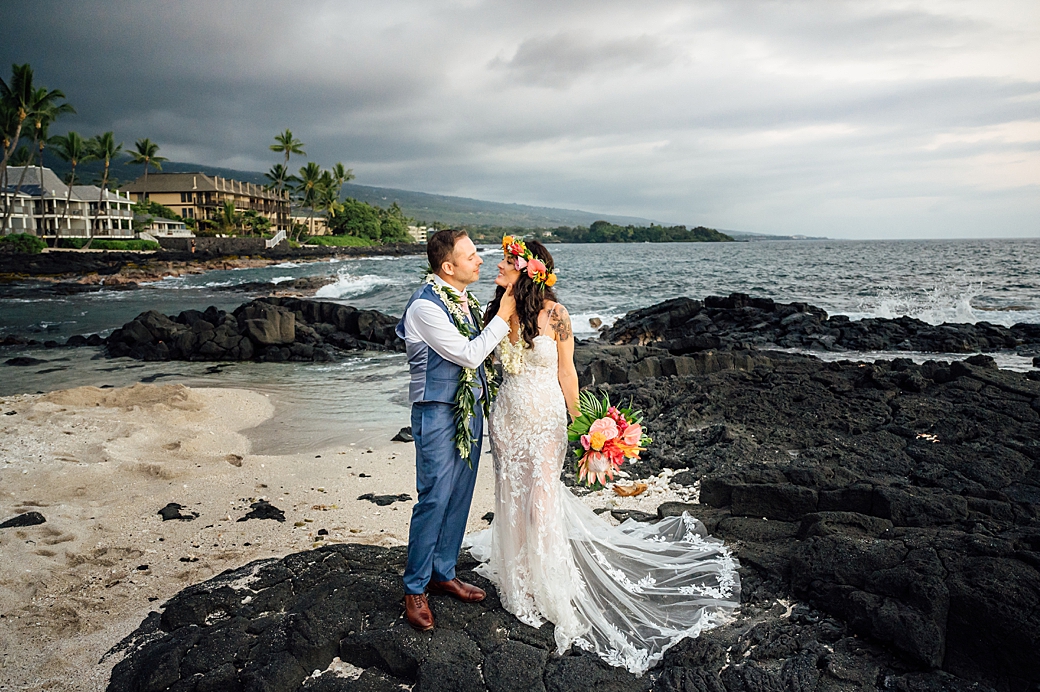 sweet moments of the bride and groom on the lava rocks in Hawaii