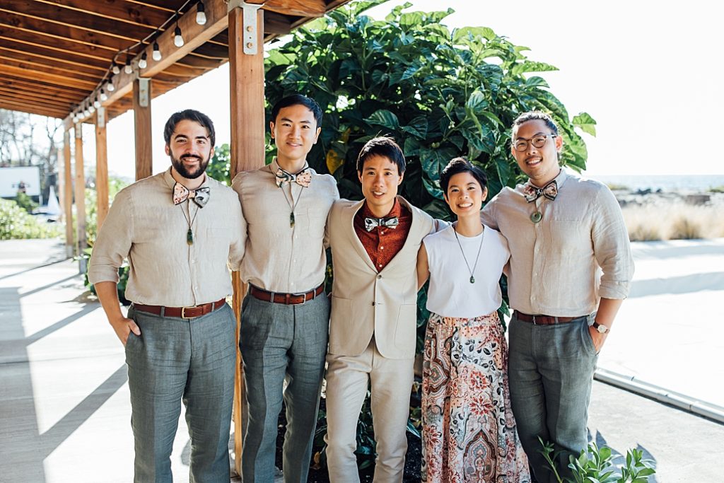 groom with his wedding party by wedding photographer