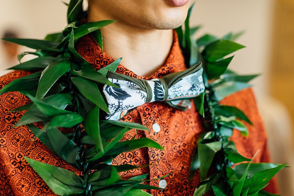 groom's bowtie and lei by wedding photographer