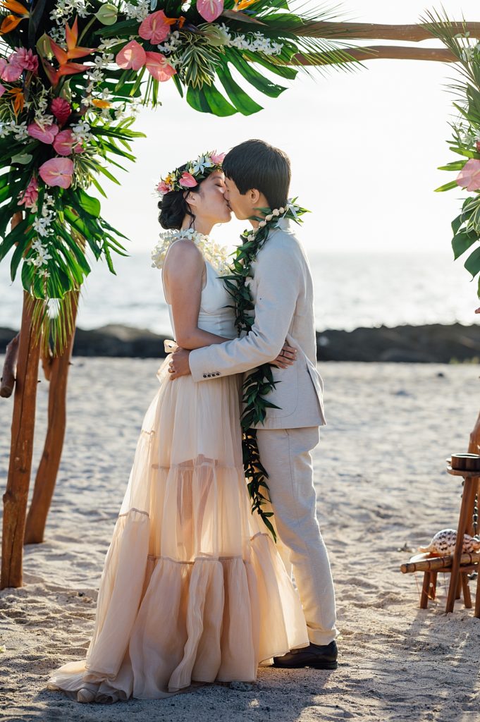 bride and groom kiss during their Kona wedding ceremony