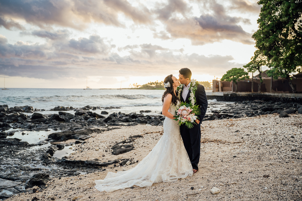sweet newlyweds about to kiss at Hawaii beach